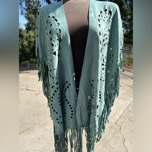 Unique sucede Faux poncho